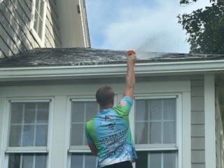 A Double S house wash in progress, photographed by the crew.