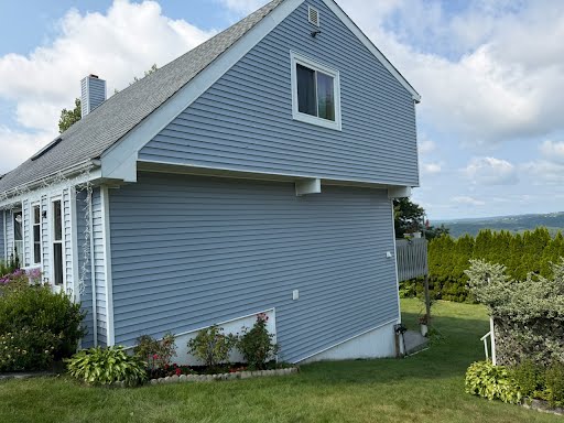 Dirty siding before and after a Double S house wash — clean, even finish.